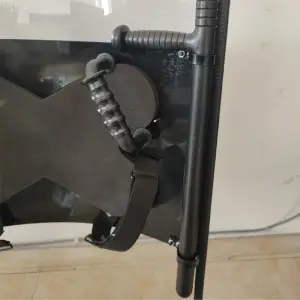 Anti riot shield with baton holder